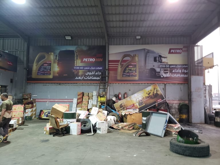 Industrial warehouse with metal siding and large Petro brand oil advertisement banners