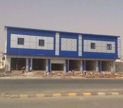 Blue and white commercial building under construction