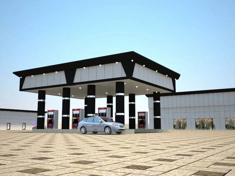 Modern gas station with black canopy, white columns, and blue car parked in front on empty paved lot